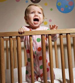 toddler in crib